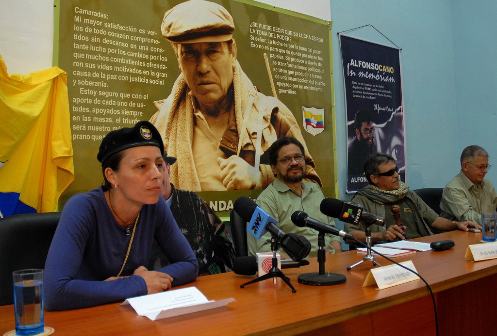 Dutch rebel Tanja Nijmeijer from the Revolutionary Armed Forces of Colombia, or FARC, left, speaks during a press conference with fellow member of the FARC negotiating team Ivan Marquez, center right, and Jesus Santrich,second from right,  at the headquarters of the Cuban agency Prensa Latina in Havana, Cuba, Tuesday, Nov. 6, 2012.  Peace talksbetween the FARC and the Colombian government schedule to start on Nov. 15. (AP Photo/Jorge Pérez, Prensa Latina) Cuba Colombia Peace Talks